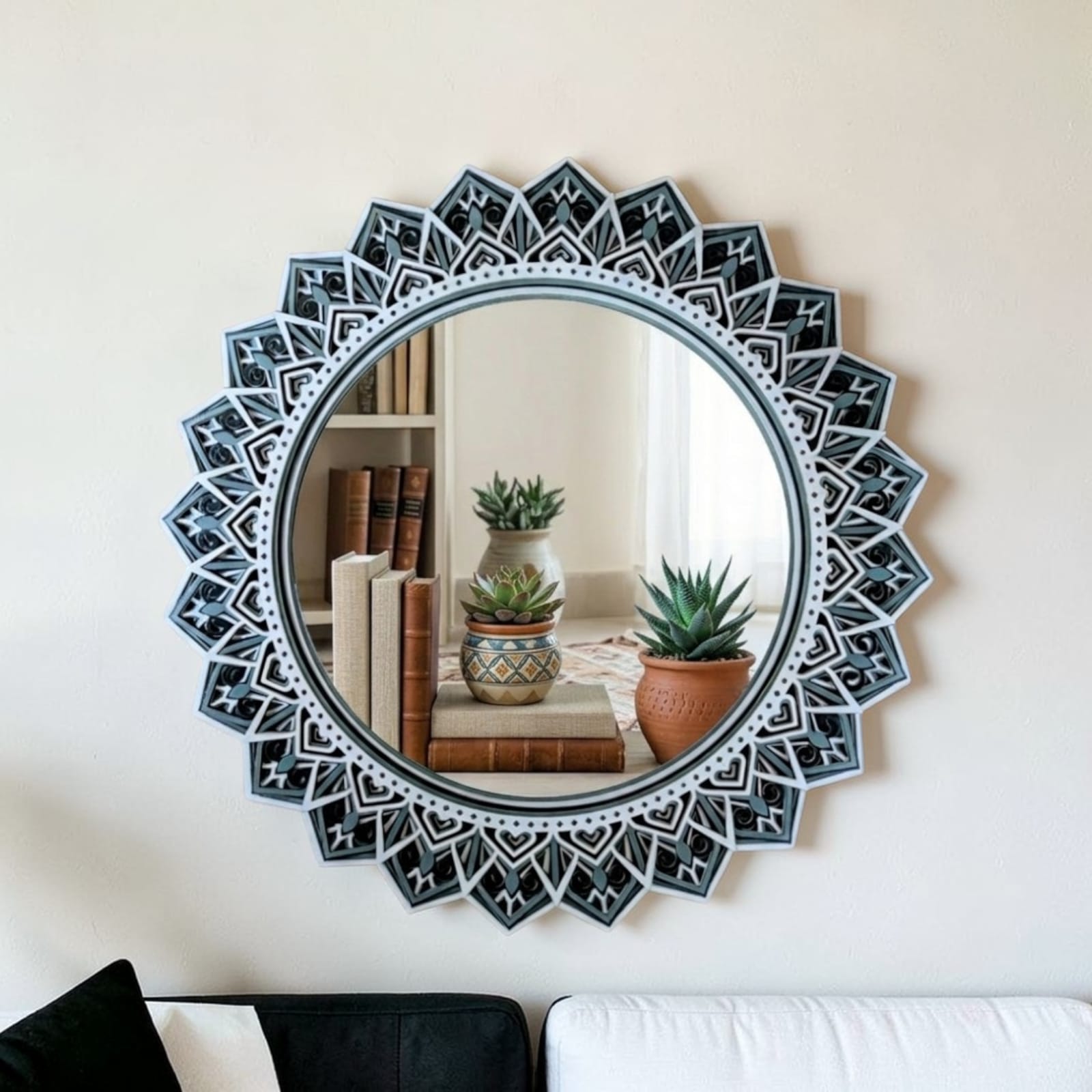 Black and white mandala mirror displayed on a modern living room wall
