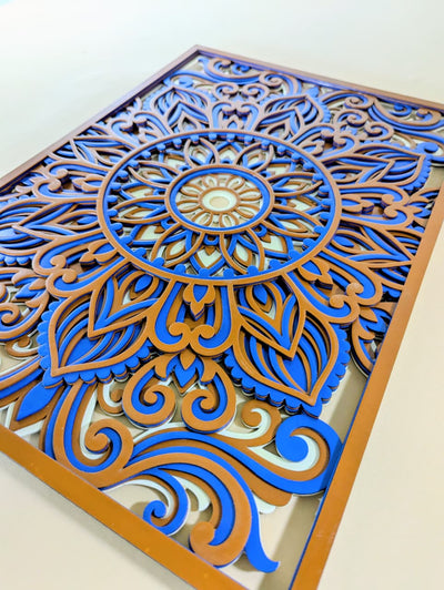 Neelambara blue and gold mandala wall art displayed in a modern living room