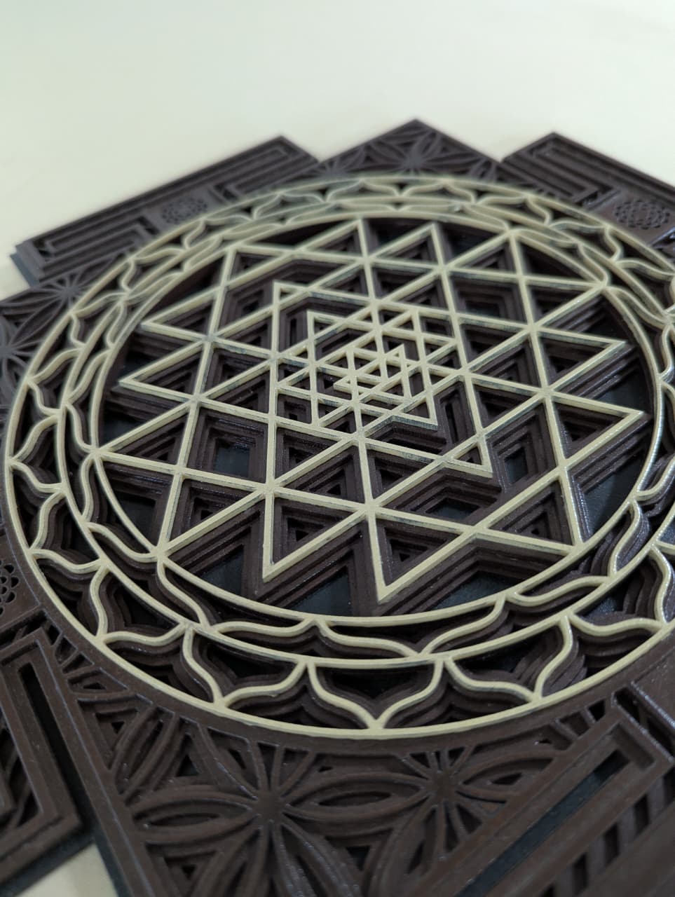 Intricate layered Sri Yantra geometric detailing on wooden wall art
