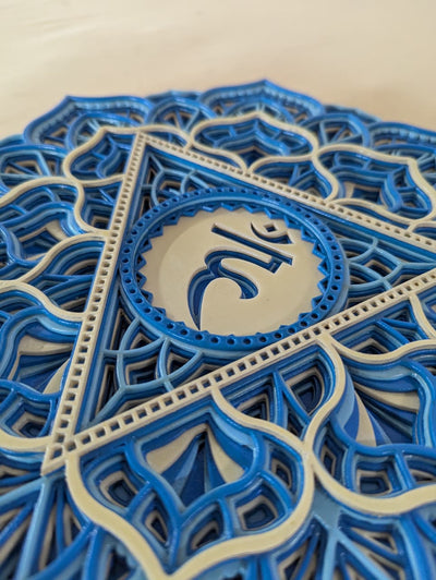 Intricate laser-cut Vishuddha chakra mandala detailing on wooden wall art