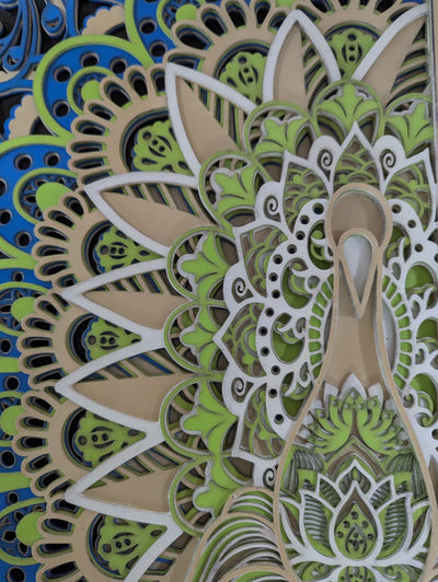 Intricate layered peacock and lotus mandala detailing on wooden wall art