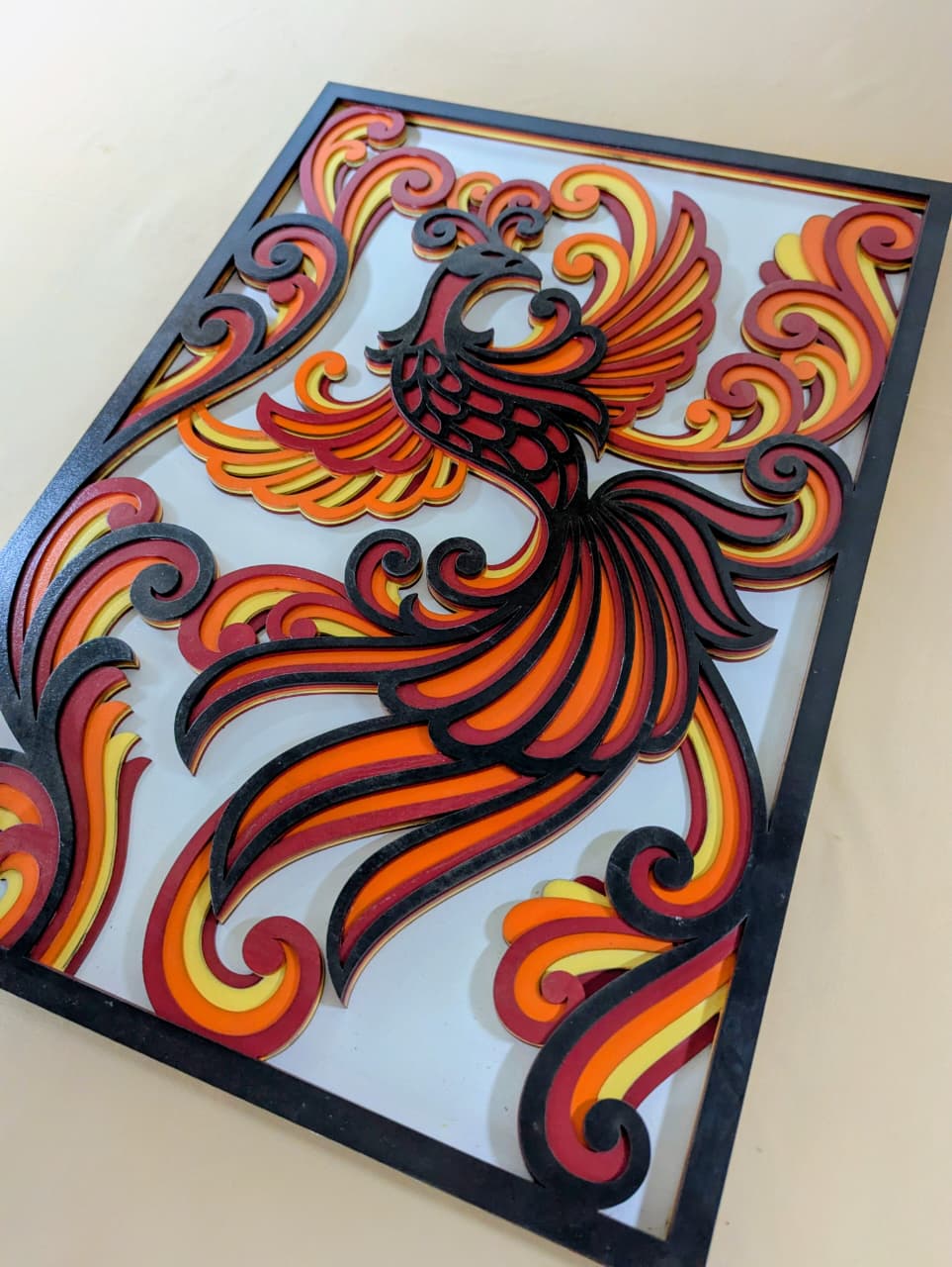 Layered phoenix mandala cutwork on Phoenix Ascend wooden wall art